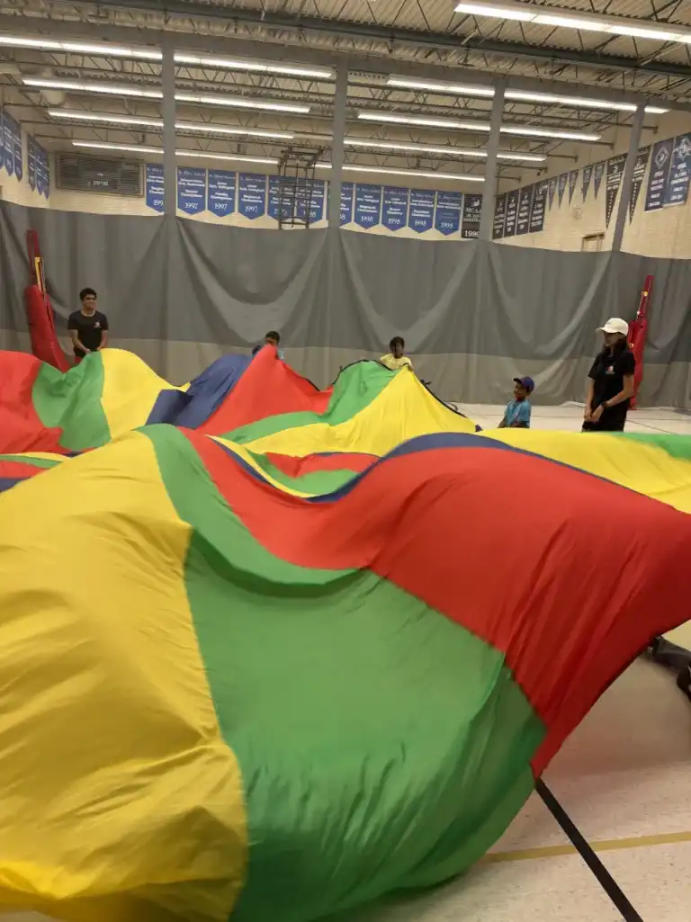 Children participating in creative projects and team-building games during Boswin’s Multi Sports Camp in Mississauga.