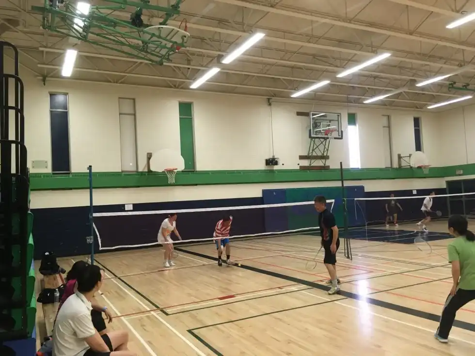 Adults enjoying recreational badminton in an indoor facility through Boswin’s badminton program in Mississauga, Brampton, and Oakville.
