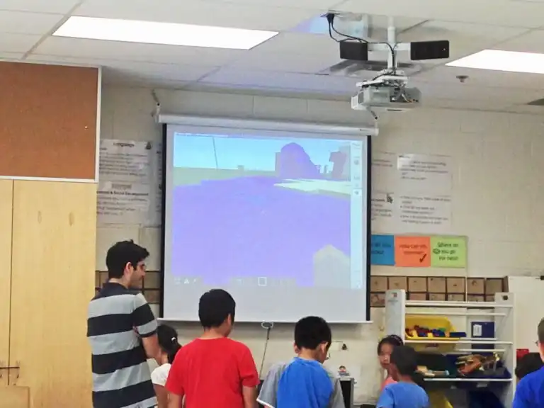 Children working together on digital building challenges at Boswin’s Minecraft Education March Break Camp in Mississauga.