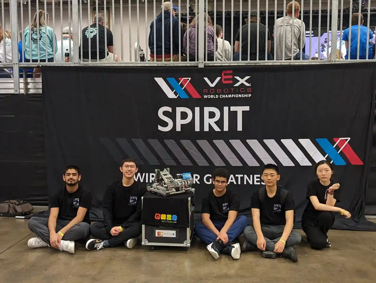 High school students competing in a VEX robotics competition at Boswin Robotics in Mississauga, building and coding advanced robots.