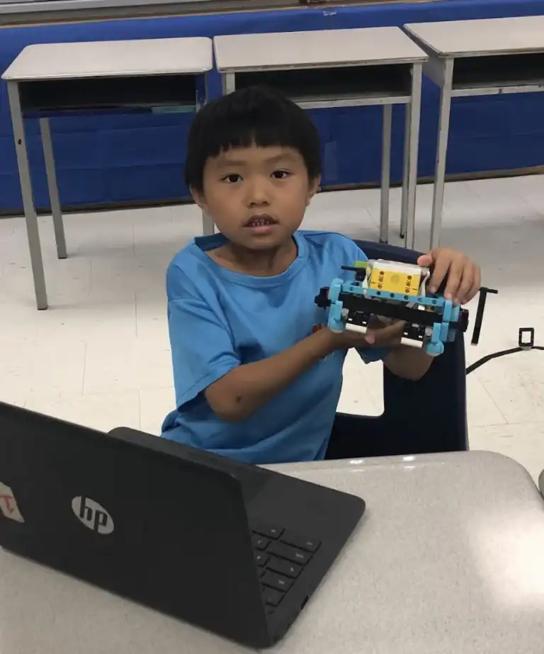 Kids aged 10–14 learning Python and AI through gamified coding projects at Boswin’s Junior Coding & Sports Camp in Mississauga.