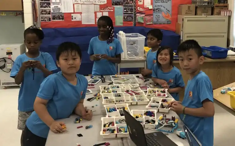 Kids aged 10 and up building and programming LEGO® EV3 and Spike Prime robots at Boswin’s Junior Robotics Summer Camp in Mississauga.