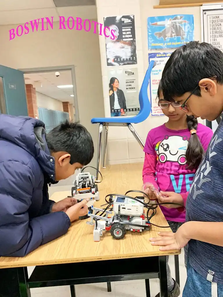 Kids aged 10 to 14 building and programming robots with sensors at Boswin’s Junior Robotics March Break Camp in Mississauga.