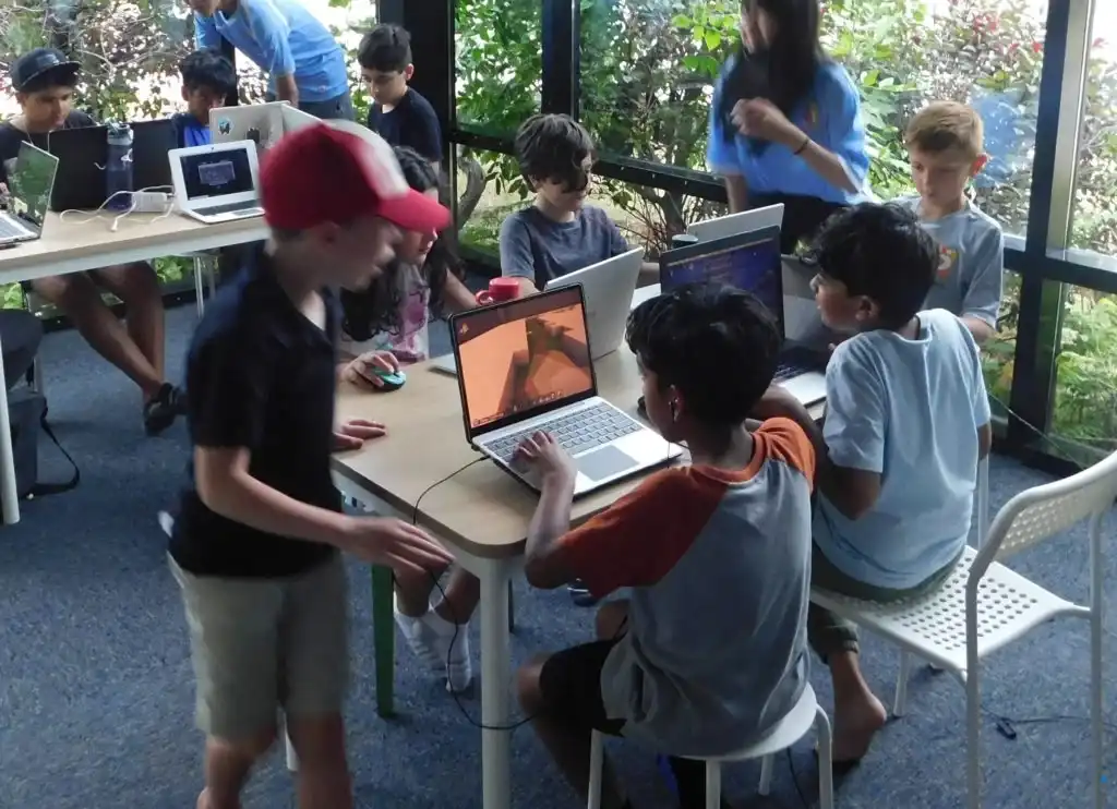 Kids exploring coding and problem-solving through Minecraft Education during Boswin’s March Break Camp in Mississauga.