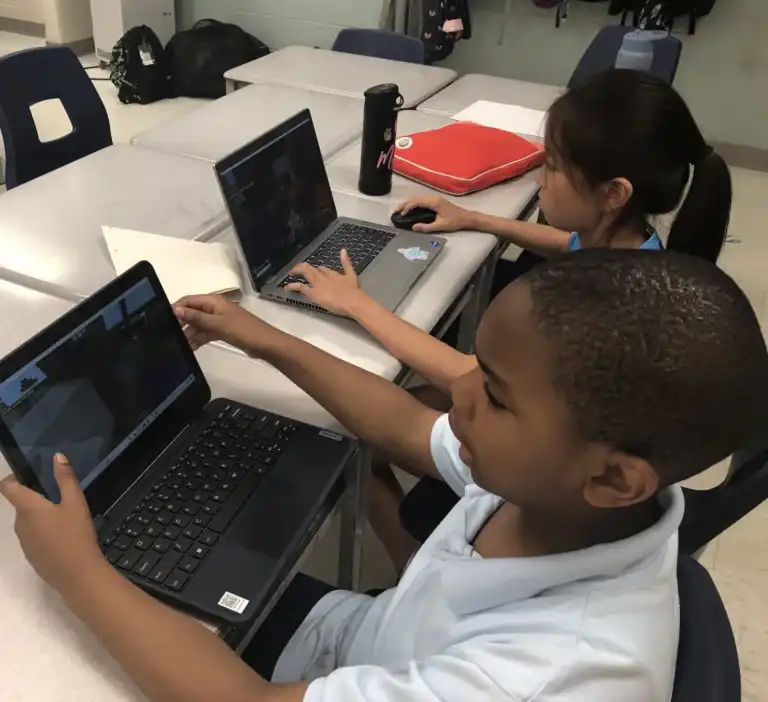 Kids building and exploring digital worlds in Minecraft Education at Boswin’s summer camp in Mississauga.