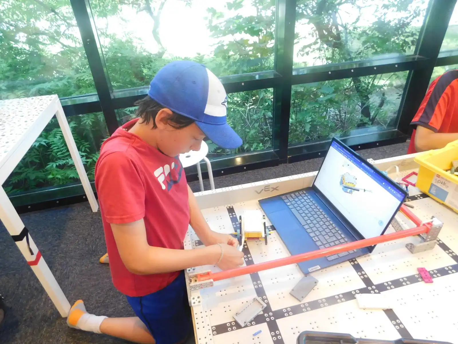 Children aged 6–9 learning foundational coding and robotics through interactive activities at Boswin’s Primary Coding Program in Mississauga.