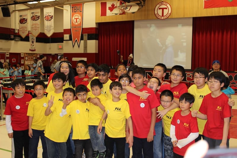 Boswin Robotics students working together during the 2015 First Lego League Robotics Competition