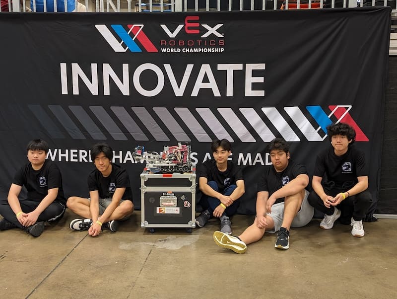 Boswin Robotics students working on their robot during the 2024 VEX Robotics Competition in Mississauga